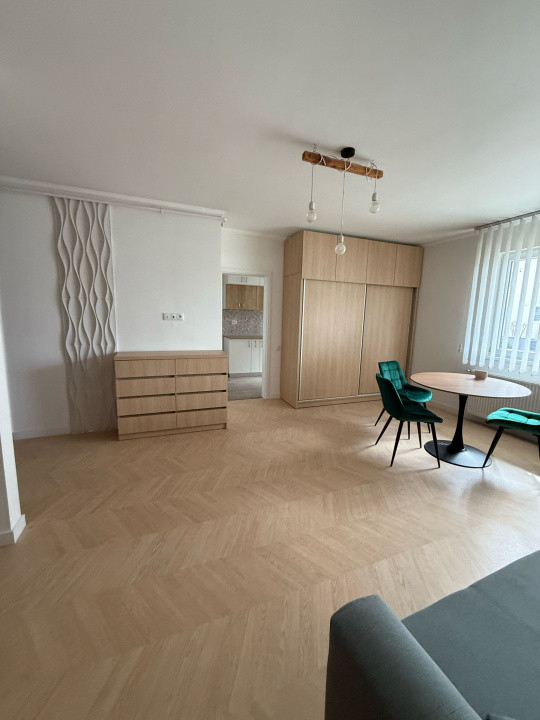 Studio spațios cu nișă de dormit | 45 mp utili | Parter | Mobilat